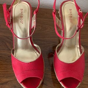Women’s red and gold wedge